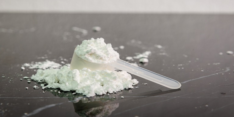 Creatine gummies and powder side by side